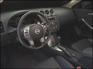The front-wheel drive, five-passenger Nissan Altima combines performance and an attractive exterior as either a two-door coupe or a four-door sedan. The Nissan Altima is powered by either a 175-hp 2.5-liter V6 or a 270-hp 3.5-liter V6 and the transmission choices include a six-speed manual or continuously variable transmission (CVT). The trims on the Altima include: the 2.5 Base (on the sedan only), the 2.5 S, the 3.5 SE and the 3.5 SL (on the sedan only). Safety features include: four-wheel disc brakes, anti-lock brakes on all trims except for the Sedan 2.5 Base, six airbags, front seat-belt pre-tensioners and a tire pressure monitoring system (TPMS). The coupe's roofline is 2.6 inches lower than the sedan's and flows back into a long and nicely sculpted tail section that narrows between wide shoulders above prominent wheel arches. The suspension is tuned to provide the driver with a more nimble feel and heightened responsiveness.Research the Nissan AltimaNissan Altima OverviewNissan Altima PicturesFree Nissan Altima Price Quote
