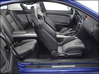 The aggressively styled RX-8 is a true four-seat sports car thanks to its near-perfect 50-50 weight distribution, and light weight, high-revving rotary engine. The RX-8 is available in four trims, Sport, Touring, Grand Touring and the R3. A 232 horsepower rotary engine is mated to a six-speed manual transmission, while six-speed automatic equipped cars get 212 horsepower. The six-speed automatic comes with steering-wheel mounted paddle shifters for sequential sport shifting. It seats four adults very comfortable and has two small rear opening "Freestyle" doors making entering and exiting the rear seats much easier than a typical two-door sports car. Standard safety features include front and side-impact airbags for the front occupants, curtain airbags front and rear, four-wheel anti-lock disc brakes, stability control with traction control and tire pressure monitoring.Research the Mazda RX-8Mazda RX-8 OverviewMazda RX-8 PicturesFree Mazda RX-8 Price Quote