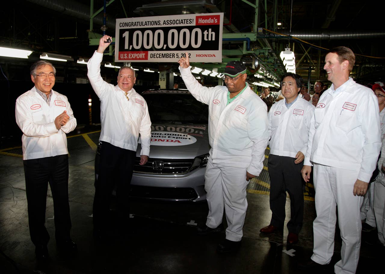 American Honda President Tetsuo Iwamura and Jim Burrell join Tyrone Moore, Hide Iwata, Jeff Tomko and over 500 other Honda of America Manufacturing, Inc. associates to commemorate the production of Honda's 1 millionth U.S. export vehicle - a Honda Accord EX-L - headed to Seoul, South Korea. (Photo Credit: Paul Vernon)