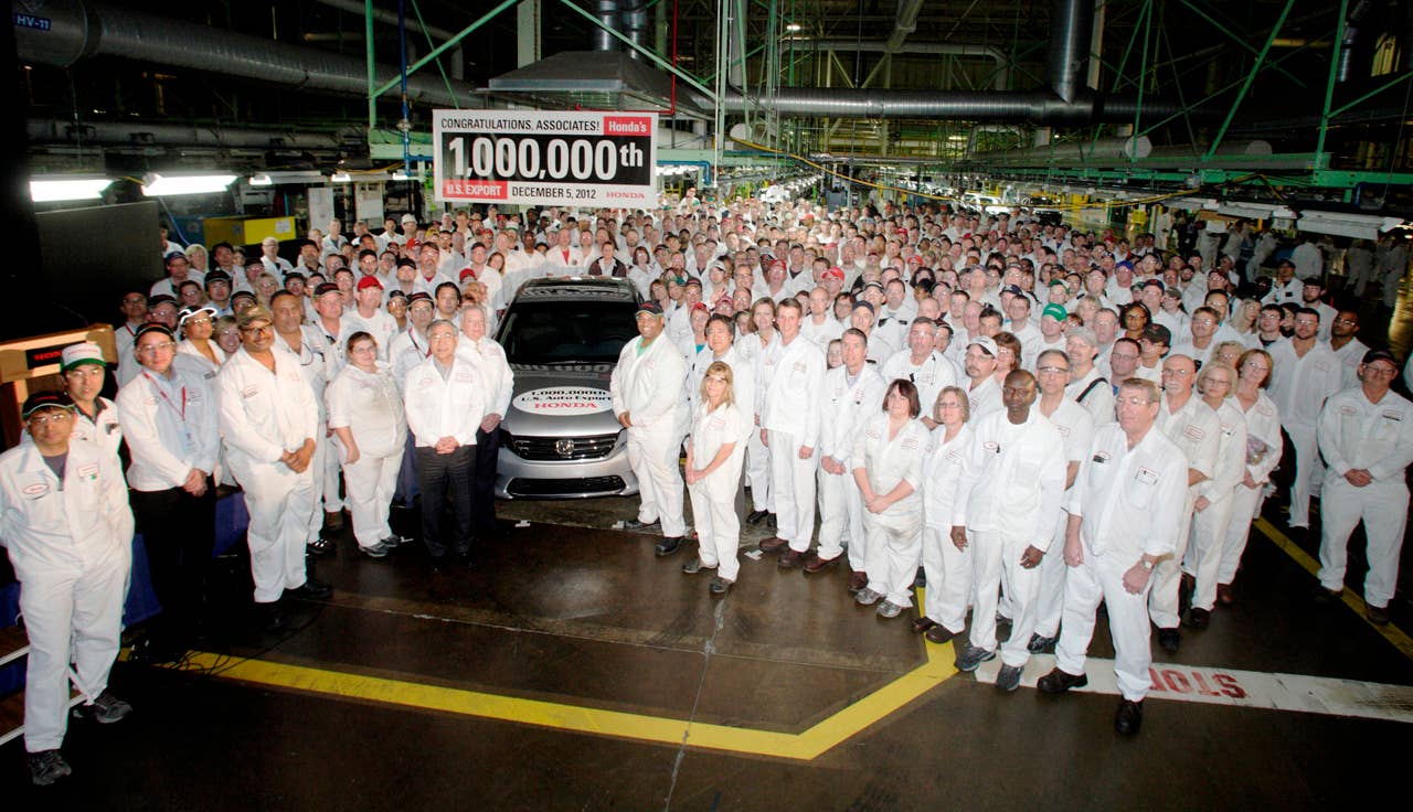 American Honda President Tetsuo Iwamura and Jim Burrell join Tyrone Moore, Hide Iwata, Jeff Tomko and over 500 other Honda of America Manufacturing, Inc. associates to commemorate the production of Honda's 1 millionth U.S. export vehicle - a Honda Accord EX-L - headed to Seoul, South Korea. (Photo Credit: Paul Vernon)