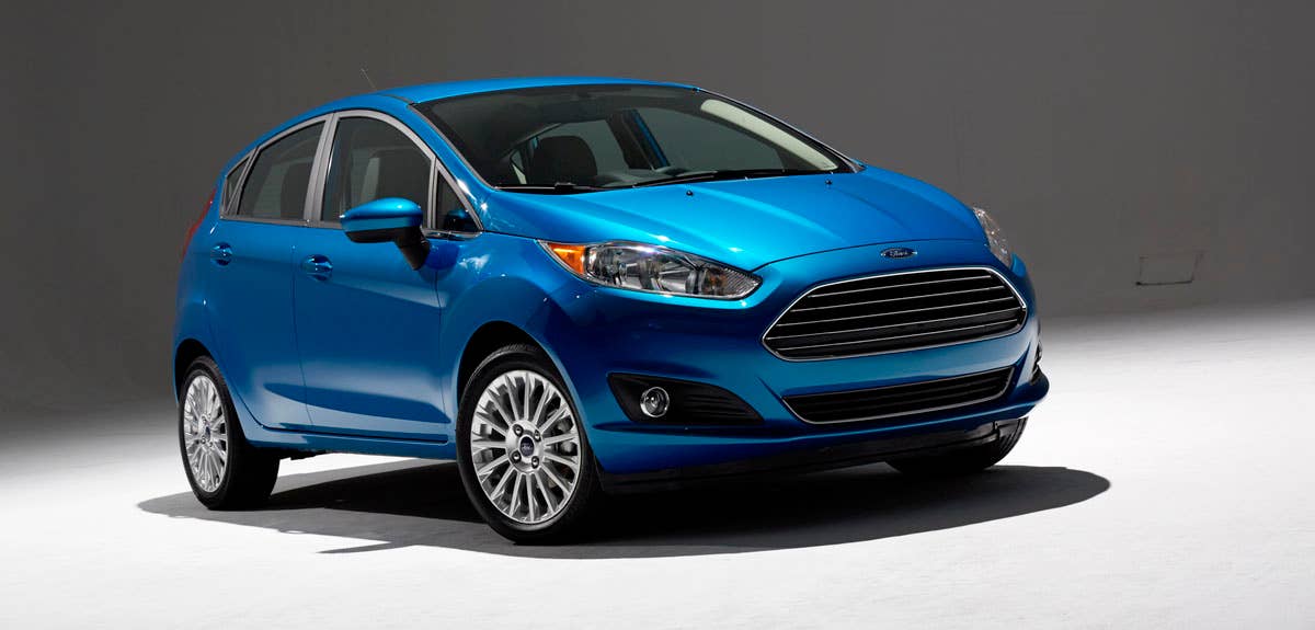 2014 Ford Fiesta 5dr: Offering more than 10 color choices, custom design exterior graphics, a mood-setting selection of ambient lighting and sexy new color options, Fiesta is built to excite the right-brain driver. (11/26/2012)