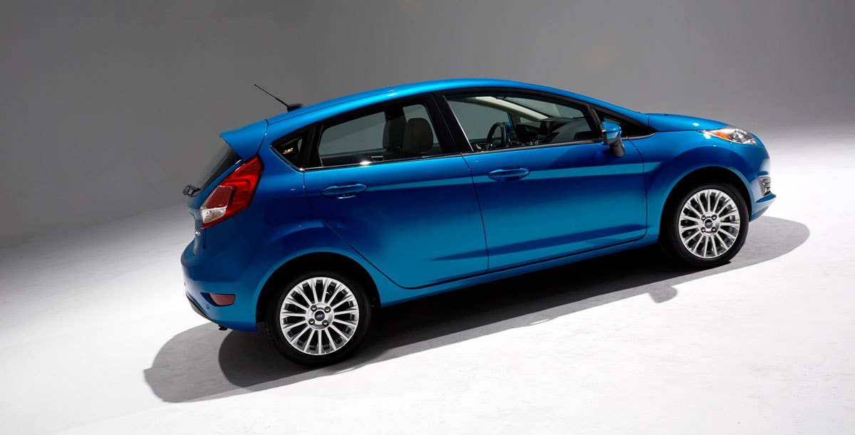 2014 Ford Fiesta 5dr: Offering more than 10 color choices, custom design exterior graphics, a mood-setting selection of ambient lighting and sexy new color options, Fiesta is built to excite the right-brain driver. (11/26/2012)