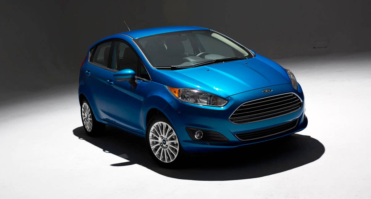 2014 Ford Fiesta 5dr: Offering more than 10 color choices, custom design exterior graphics, a mood-setting selection of ambient lighting and sexy new color options, Fiesta is built to excite the right-brain driver. (11/26/2012)