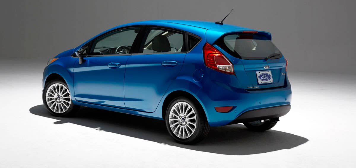 2014 Ford Fiesta 5dr: Offering more than 10 color choices, custom design exterior graphics, a mood-setting selection of ambient lighting and sexy new color options, Fiesta is built to excite the right-brain driver. (11/26/2012)