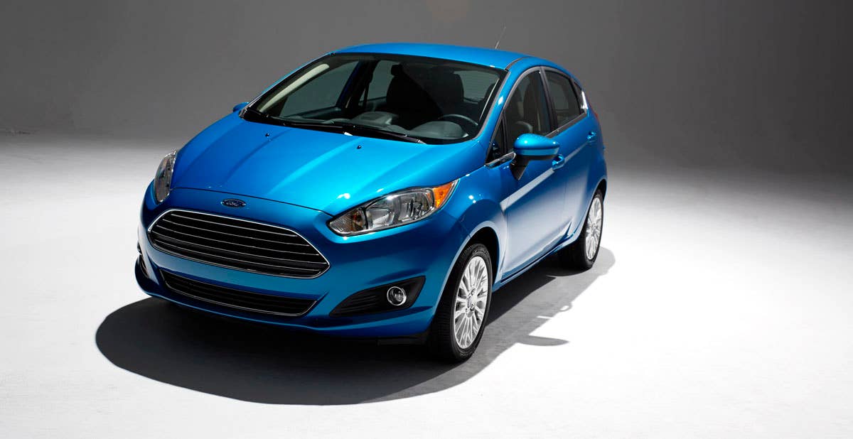 2014 Ford Fiesta 5dr: Offering more than 10 color choices, custom design exterior graphics, a mood-setting selection of ambient lighting and sexy new color options, Fiesta is built to excite the right-brain driver. (11/26/2012)