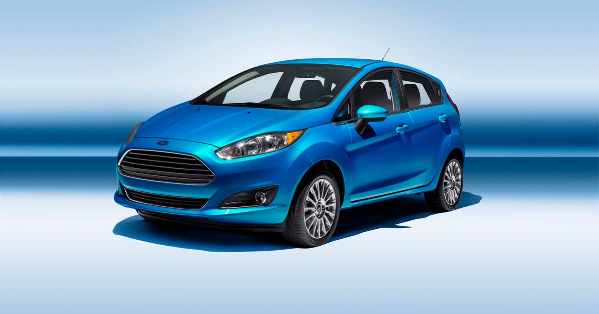 2014 Ford Fiesta 5dr: The 2014 Fiesta sports the stylish new face of Ford with a new grille, hood and tapered lines for a fun-to-drive look that makes customers want to get in and go. (11/26/2012)