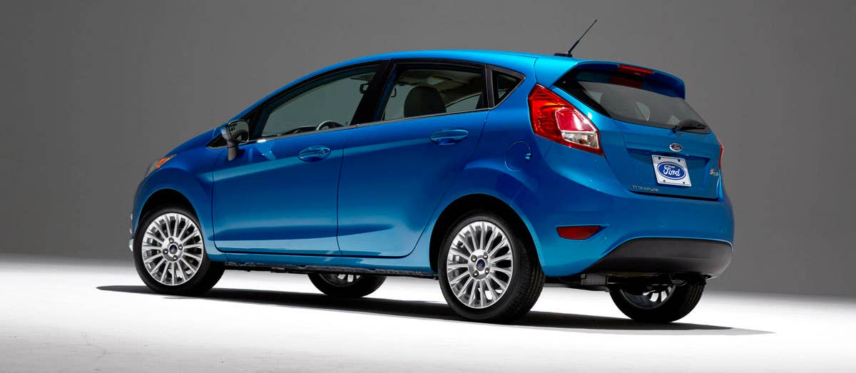 2014 Ford Fiesta 5dr: Offering more than 10 color choices, custom design exterior graphics, a mood-setting selection of ambient lighting and sexy new color options, Fiesta is built to excite the right-brain driver. (11/26/2012)