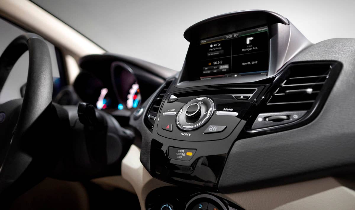 2014 Ford Fiesta 5dr: The Fiesta interior hosts one of the most comprehensive suites of in-car technologies with a cell phone-inspired dashboard and available 6.5-inch MyFord Touch screen. (11/26/2012)