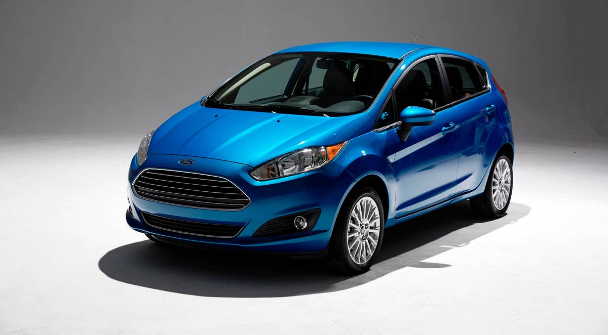 2014 Ford Fiesta 5dr: Offering more than 10 color choices, custom design exterior graphics, a mood-setting selection of ambient lighting and sexy new color options, Fiesta is built to excite the right-brain driver. (11/26/2012)