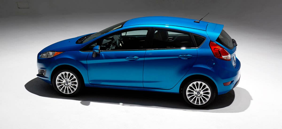 2014 Ford Fiesta 5dr: Offering more than 10 color choices, custom design exterior graphics, a mood-setting selection of ambient lighting and sexy new color options, Fiesta is built to excite the right-brain driver. (11/26/2012)