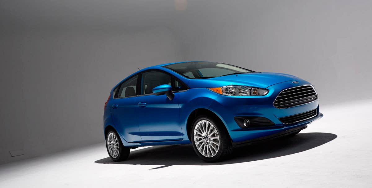 2014 Ford Fiesta 5dr: Offering more than 10 color choices, custom design exterior graphics, a mood-setting selection of ambient lighting and sexy new color options, Fiesta is built to excite the right-brain driver. (11/26/2012)