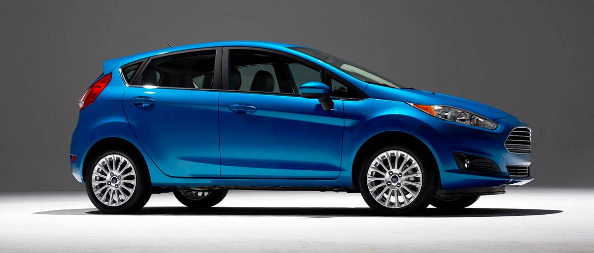 2014 Ford Fiesta 5dr: Offering more than 10 color choices, custom design exterior graphics, a mood-setting selection of ambient lighting and sexy new color options, Fiesta is built to excite the right-brain driver. (11/26/2012)