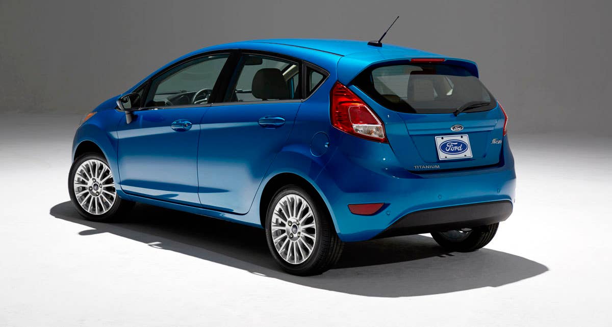 2014 Ford Fiesta 5dr: Offering more than 10 color choices, custom design exterior graphics, a mood-setting selection of ambient lighting and sexy new color options, Fiesta is built to excite the right-brain driver. (11/26/2012)