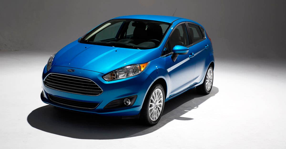 2014 Ford Fiesta 5dr: Offering more than 10 color choices, custom design exterior graphics, a mood-setting selection of ambient lighting and sexy new color options, Fiesta is built to excite the right-brain driver. (11/26/2012)