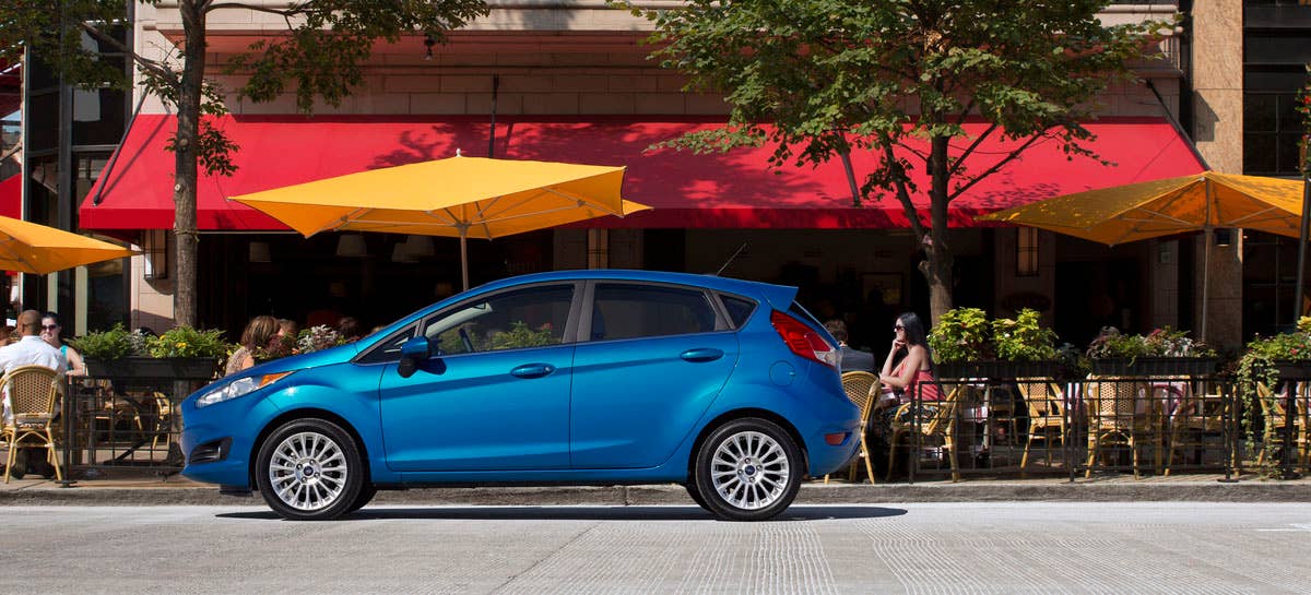 2014 Ford Fiesta 5dr: The 2014 Fiesta sports the stylish new face of Ford with a new grille, hood and tapered lines for a fun-to-drive look that makes customers want to get in and go.  (11/27/2012)