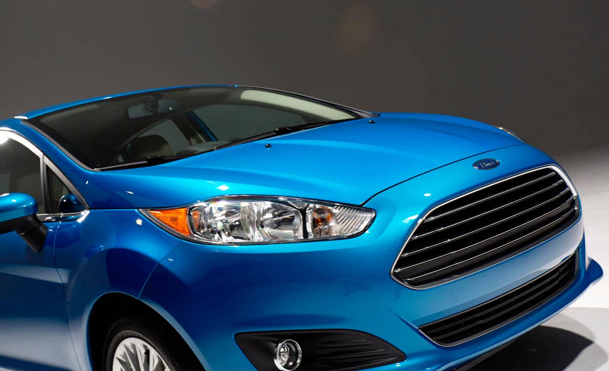 2014 Ford Fiesta 5dr: Offering more than 10 color choices, custom design exterior graphics, a mood-setting selection of ambient lighting and sexy new color options, Fiesta is built to excite the right-brain driver. (11/26/2012)