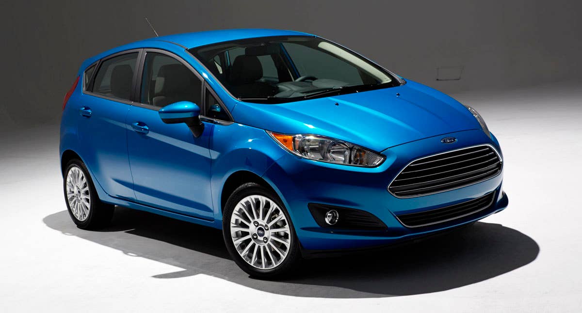 2014 Ford Fiesta 5dr: Offering more than 10 color choices, custom design exterior graphics, a mood-setting selection of ambient lighting and sexy new color options, Fiesta is built to excite the right-brain driver. (11/26/2012)