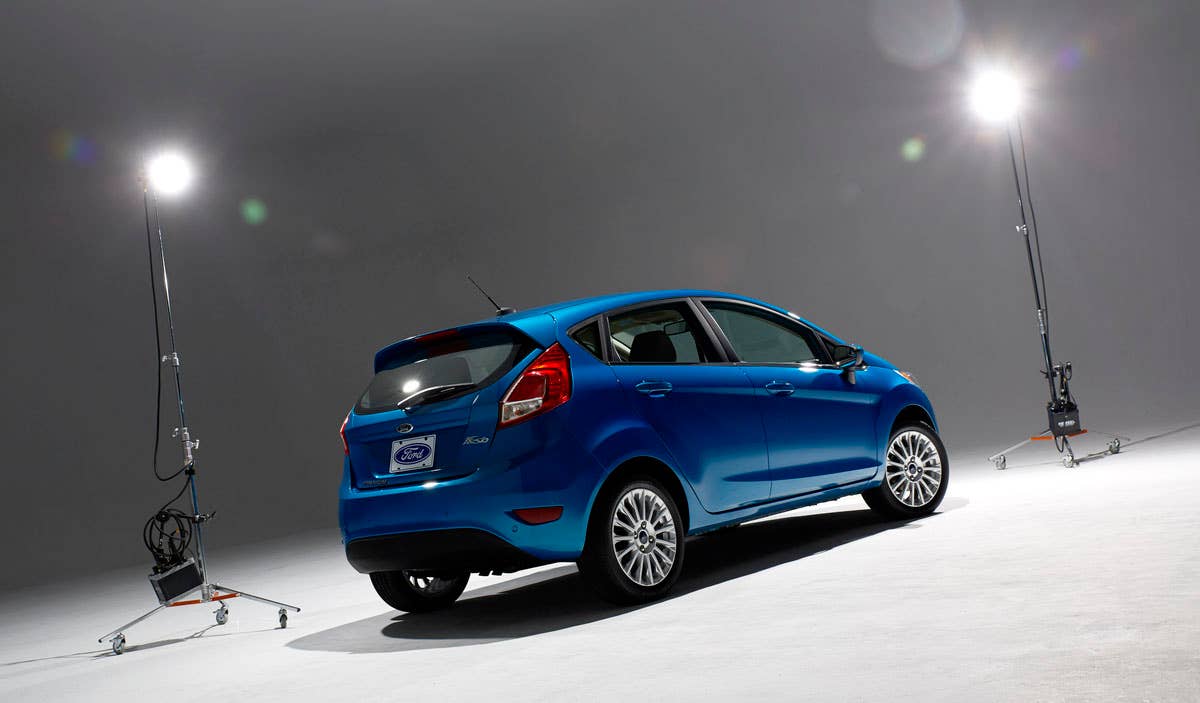 2014 Ford Fiesta 5dr: Offering more than 10 color choices, custom design exterior graphics, a mood-setting selection of ambient lighting and sexy new color options, Fiesta is built to excite the right-brain driver. (11/26/2012)
