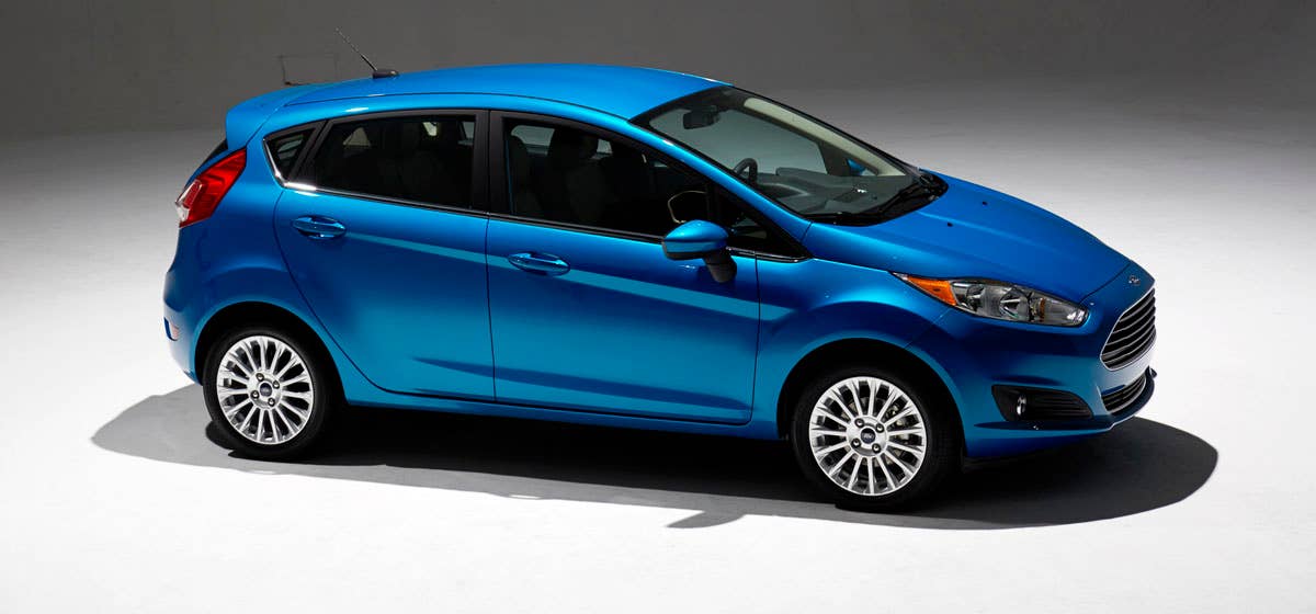 2014 Ford Fiesta 5dr: Offering more than 10 color choices, custom design exterior graphics, a mood-setting selection of ambient lighting and sexy new color options, Fiesta is built to excite the right-brain driver. (11/26/2012)