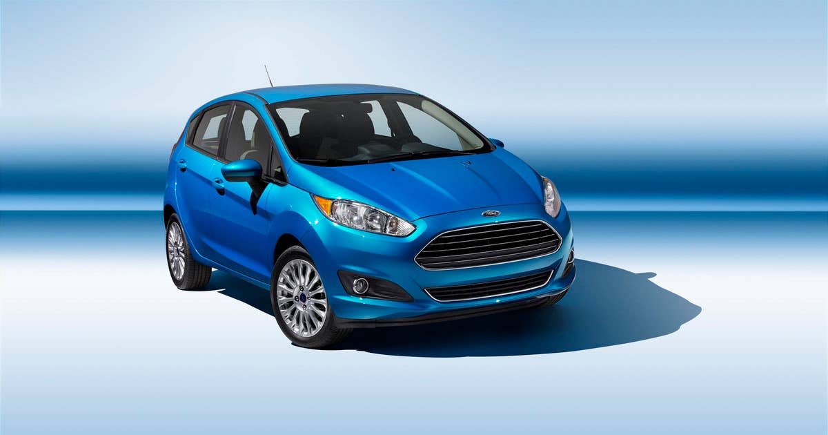 2014 Ford Fiesta 5dr: The 2014 Fiesta sports the stylish new face of Ford with a new grille, hood and tapered lines for a fun-to-drive look that makes customers want to get in and go. (11/26/2012)