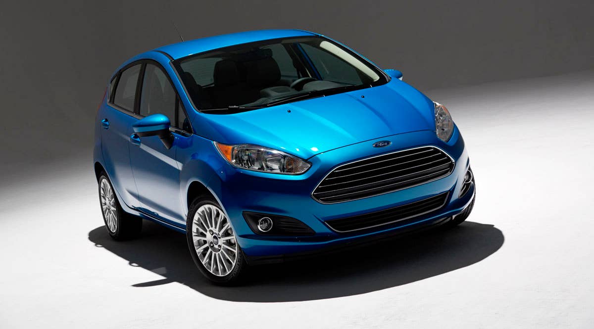 2014 Ford Fiesta 5dr: Offering more than 10 color choices, custom design exterior graphics, a mood-setting selection of ambient lighting and sexy new color options, Fiesta is built to excite the right-brain driver. (11/26/2012)