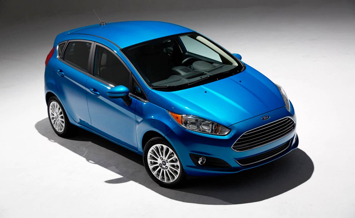 2014 Ford Fiesta 5dr: Offering more than 10 color choices, custom design exterior graphics, a mood-setting selection of ambient lighting and sexy new color options, Fiesta is built to excite the right-brain driver. (11/26/2012)