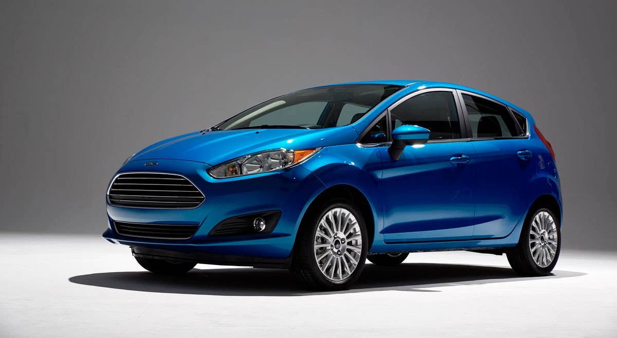 2014 Ford Fiesta 5dr: Offering more than 10 color choices, custom design exterior graphics, a mood-setting selection of ambient lighting and sexy new color options, Fiesta is built to excite the right-brain driver. (11/26/2012)