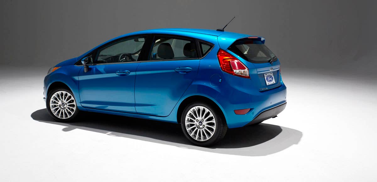 2014 Ford Fiesta 5dr: Offering more than 10 color choices, custom design exterior graphics, a mood-setting selection of ambient lighting and sexy new color options, Fiesta is built to excite the right-brain driver. (11/26/2012)