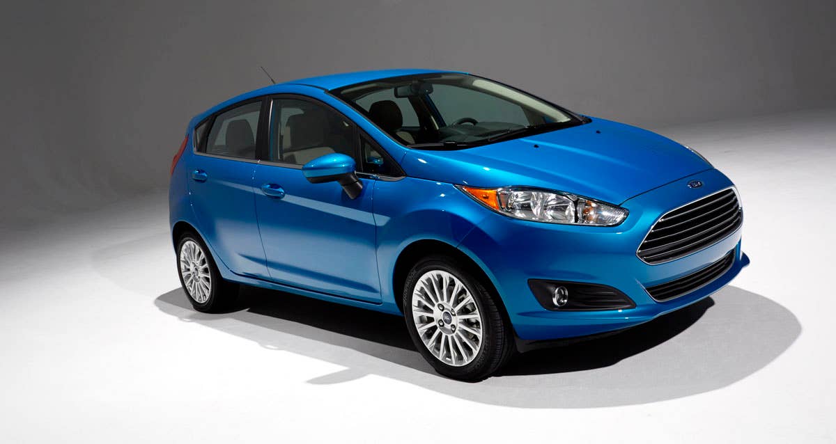 2014 Ford Fiesta 5dr: Offering more than 10 color choices, custom design exterior graphics, a mood-setting selection of ambient lighting and sexy new color options, Fiesta is built to excite the right-brain driver. (11/26/2012)