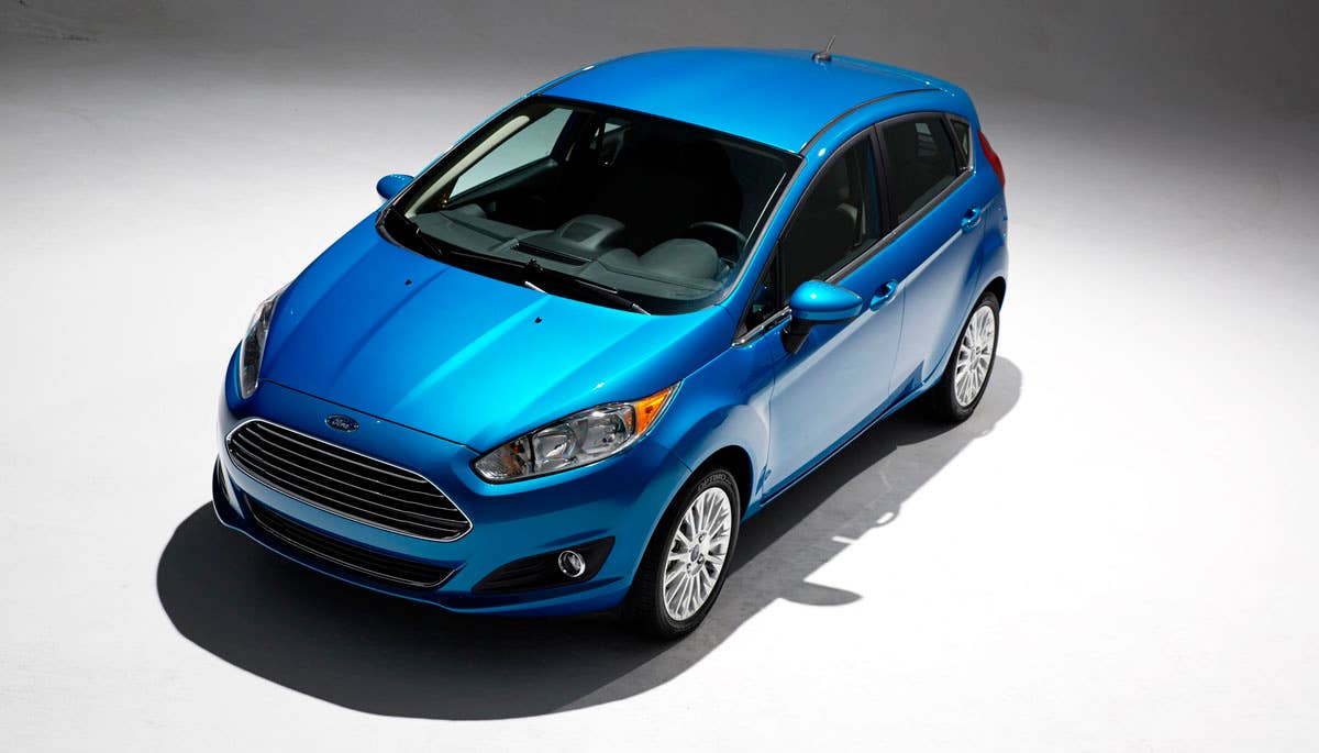 2014 Ford Fiesta 5dr: Offering more than 10 color choices, custom design exterior graphics, a mood-setting selection of ambient lighting and sexy new color options, Fiesta is built to excite the right-brain driver. (11/26/2012)