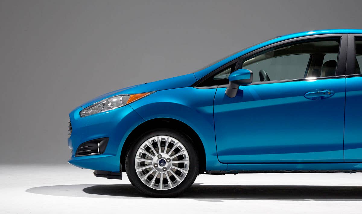 2014 Ford Fiesta 5dr: Offering more than 10 color choices, custom design exterior graphics, a mood-setting selection of ambient lighting and sexy new color options, Fiesta is built to excite the right-brain driver. (11/26/2012)
