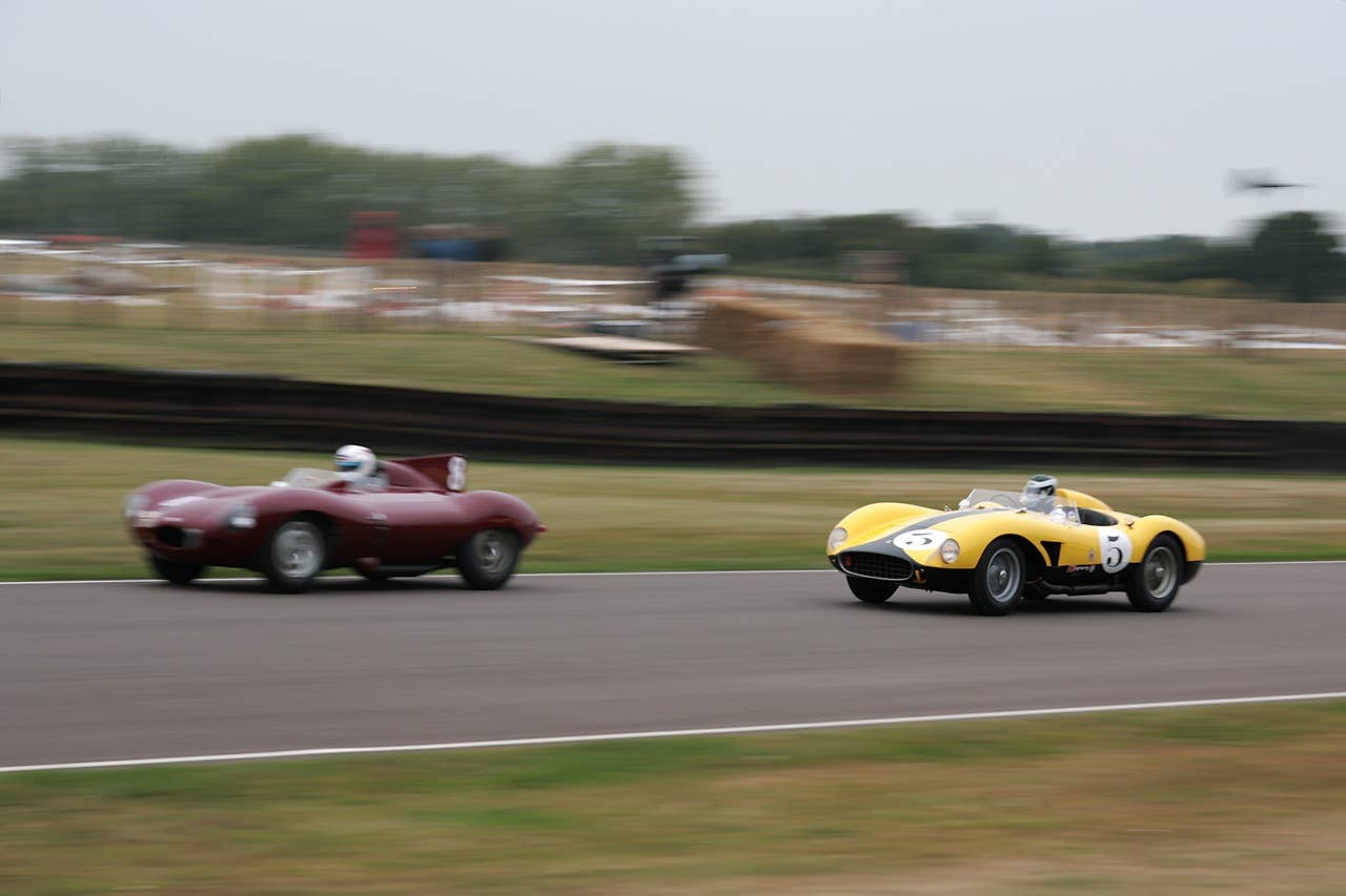 Ferrari 500 TRC chases down a Jaguar D-type in the Lavant Cup race