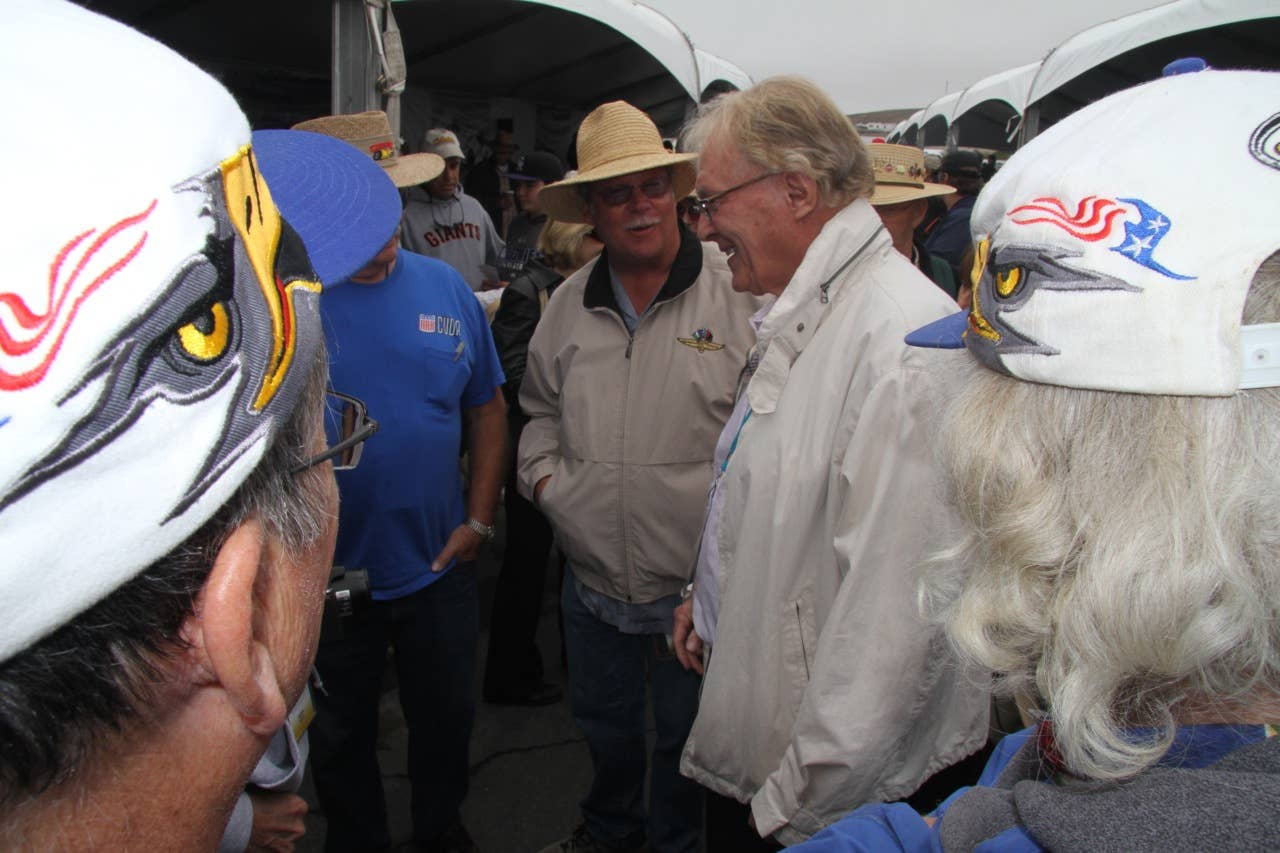 Dan Gurney talking to former crew and employees at 2010 Rolex Motorsports Reunion tribute to Gurney