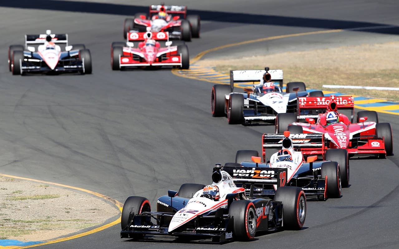 SONOMA, CA - AUGUST 22:  Will Power of Australia, driver of the #12 Verizon Team Penske Dallara Honda leads Helio Castroneves and Dario Franchitti during the IZOD IndyCar Series Grand Prix of Sonoma at Infineon Raceway on August 22, 2010 in Sonoma, California.  (Photo by Christian Petersen/Getty Images)