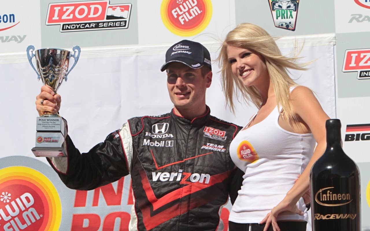 Izod Indy Car Series point leader Will Power, of Australia, holds up the trophy he received after winning the pole position for Sunday's Indy Grand Prix of Sonoma, at the Infineon Raceway in Sonoma, Calif. Saturday, Aug. 21, 2010.  Power finished with a time of 1:16:5282.(AP Photo/Rich Pedroncelli)