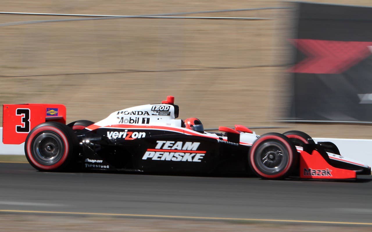 Indy car driver Helio Castroneves, of Brazil, races down a straight away during the early laps of the  Indy Grand Prix of Sonoma, at the Infineon Raceway in Sonoma, Calif. Sunday, Aug. 22, 2010.(AP Photo/Rich Pedroncelli)