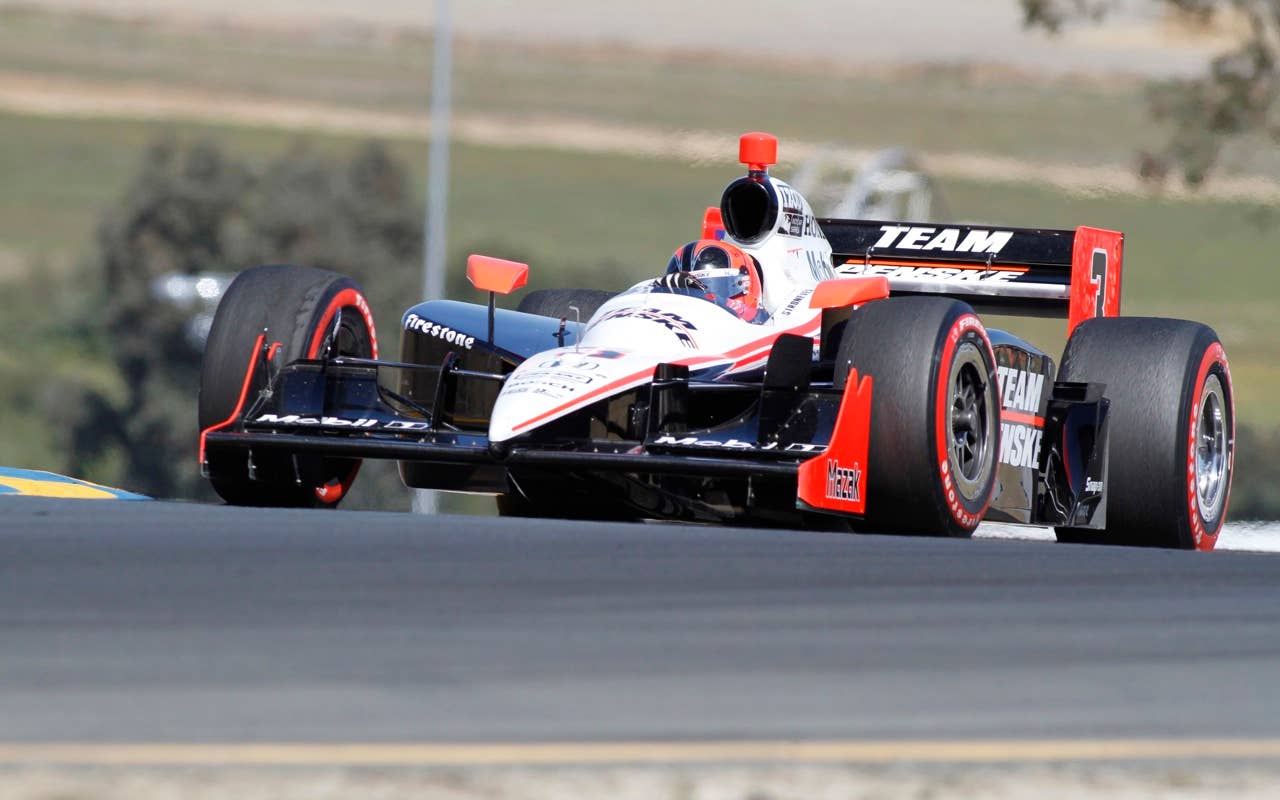 IndyCar driver Helio Castroneves of Brazil races in the Indy Grand Prix of Sonoma, Sunday, Aug. 22, 2010 at Infineon Raceway in Sonoma, Calif. (AP Photo/George Nikitin)