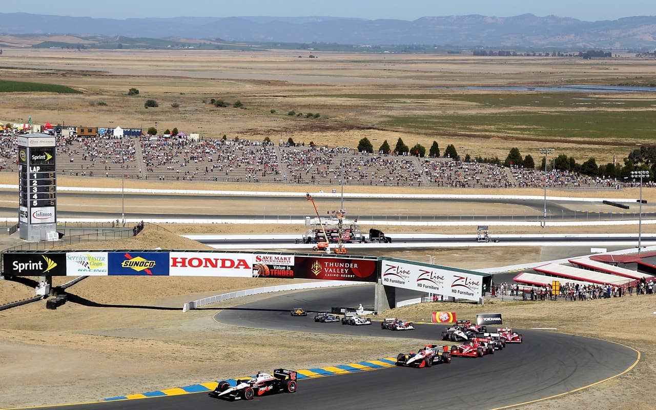 SONOMA, CA - AUGUST 22:  Will Power of Australia, driver of the #12 Verizon Team Penske Dallara Honda leads the field at the start of the IZOD IndyCar Series Grand Prix of Sonoma at Infineon Raceway on August 22, 2010 in Sonoma, California.  (Photo by Christian Petersen/Getty Images)