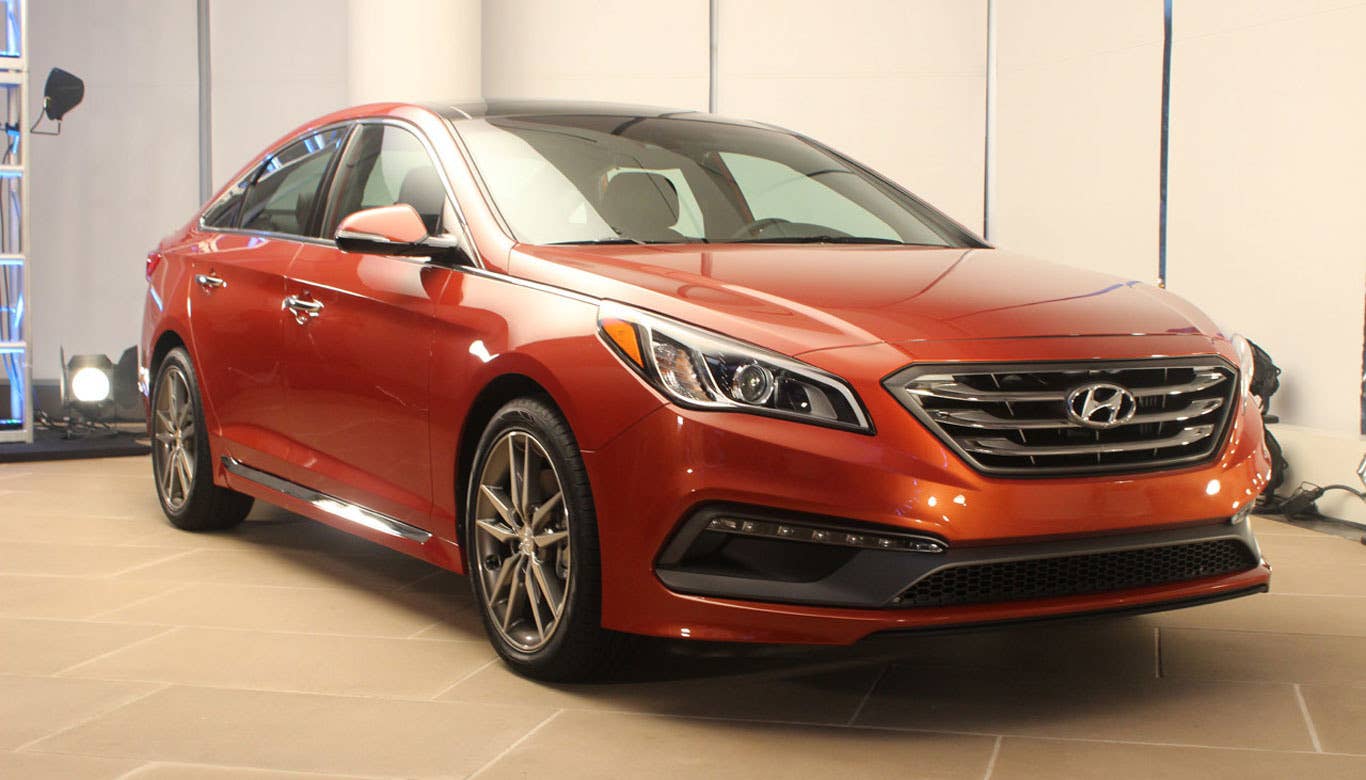 Though we've already seen the striking sedan in a wealth of recent photos, seeing the car in person confirmed that Hyundai has another hit on its hands. The Sonata employs the Korean automaker's new design language, which we already witnessed with the Genesis. Hyundai describes the language as being more dignified, respectable and confident. We certainly agree with that.  Additional updates include a redesigned and bigger interior, which Hyundai says greatly emphasizes ergonomics and comfort, a much more rigid platform, a wealth of new safety features and lots of new tech and infotainment updates, including the smart trunk, which is one of the simplest, yet most novel features we've seen in 2014.  Read More Hyundai Sonata Information Hyundai Sonata Photos