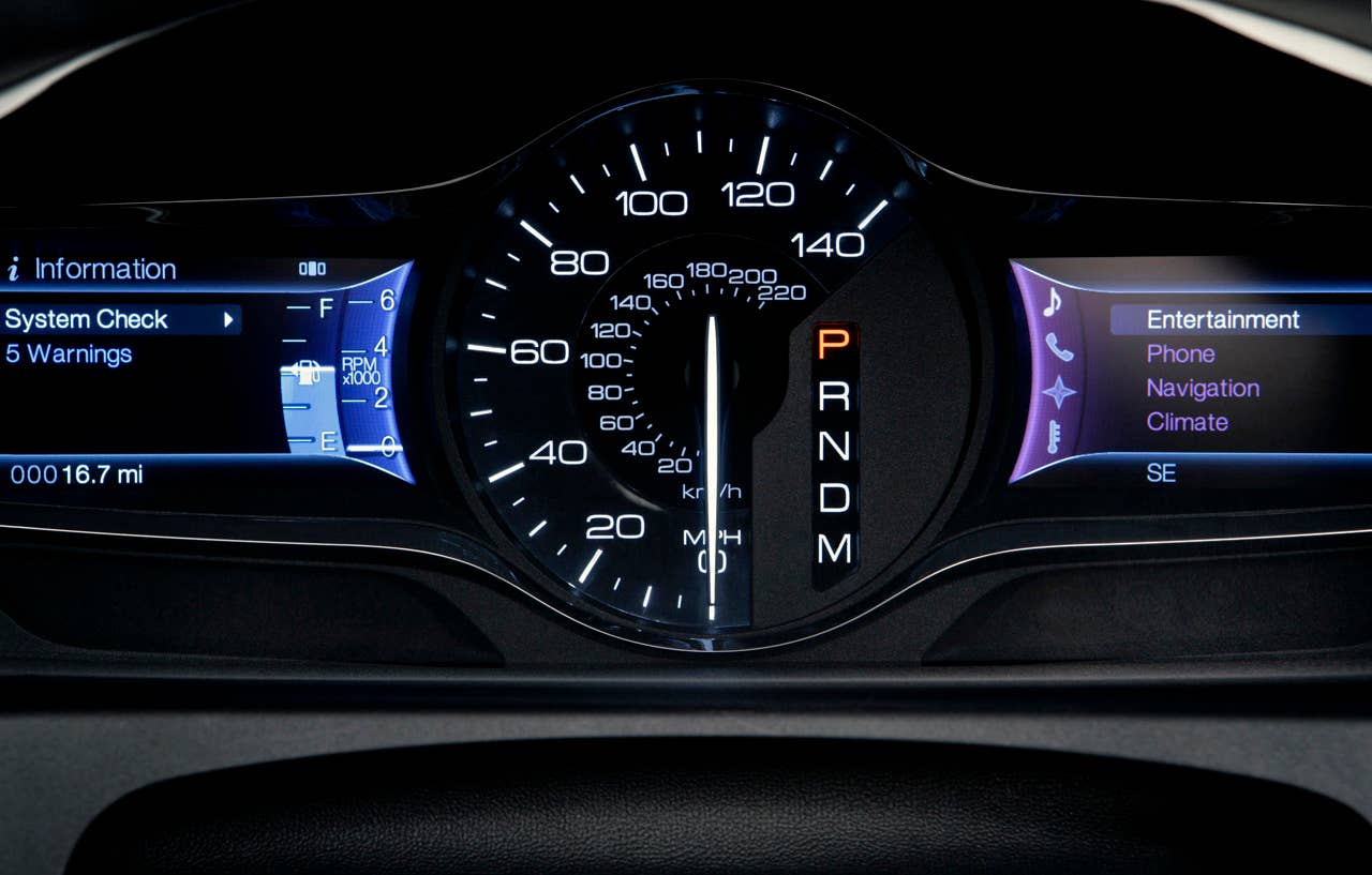 MyFord Touch displays much of its information using two 4.2-inch full-color LCD screens flanking an analog speedometer.