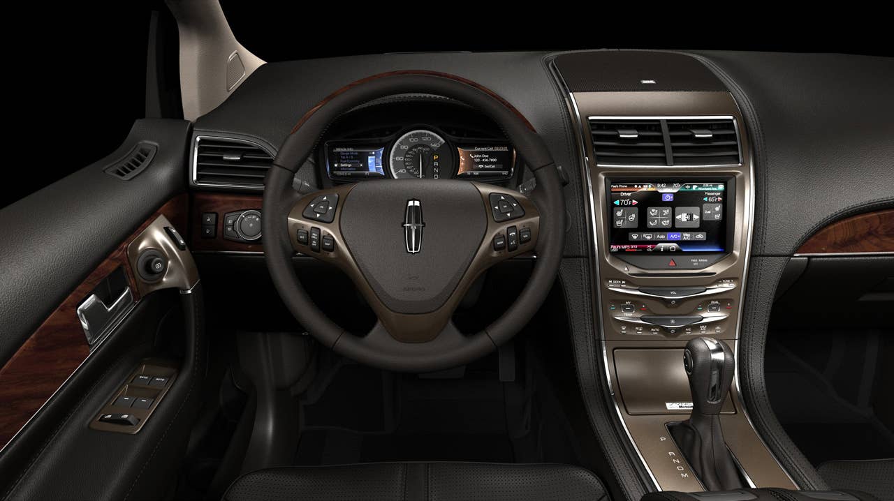 MyLincoln Touch displays information using two 4.2-inch full-color LCD screens flanking an analog speedometer and an 8-inch touch-screen LCD at the top of the center stack.