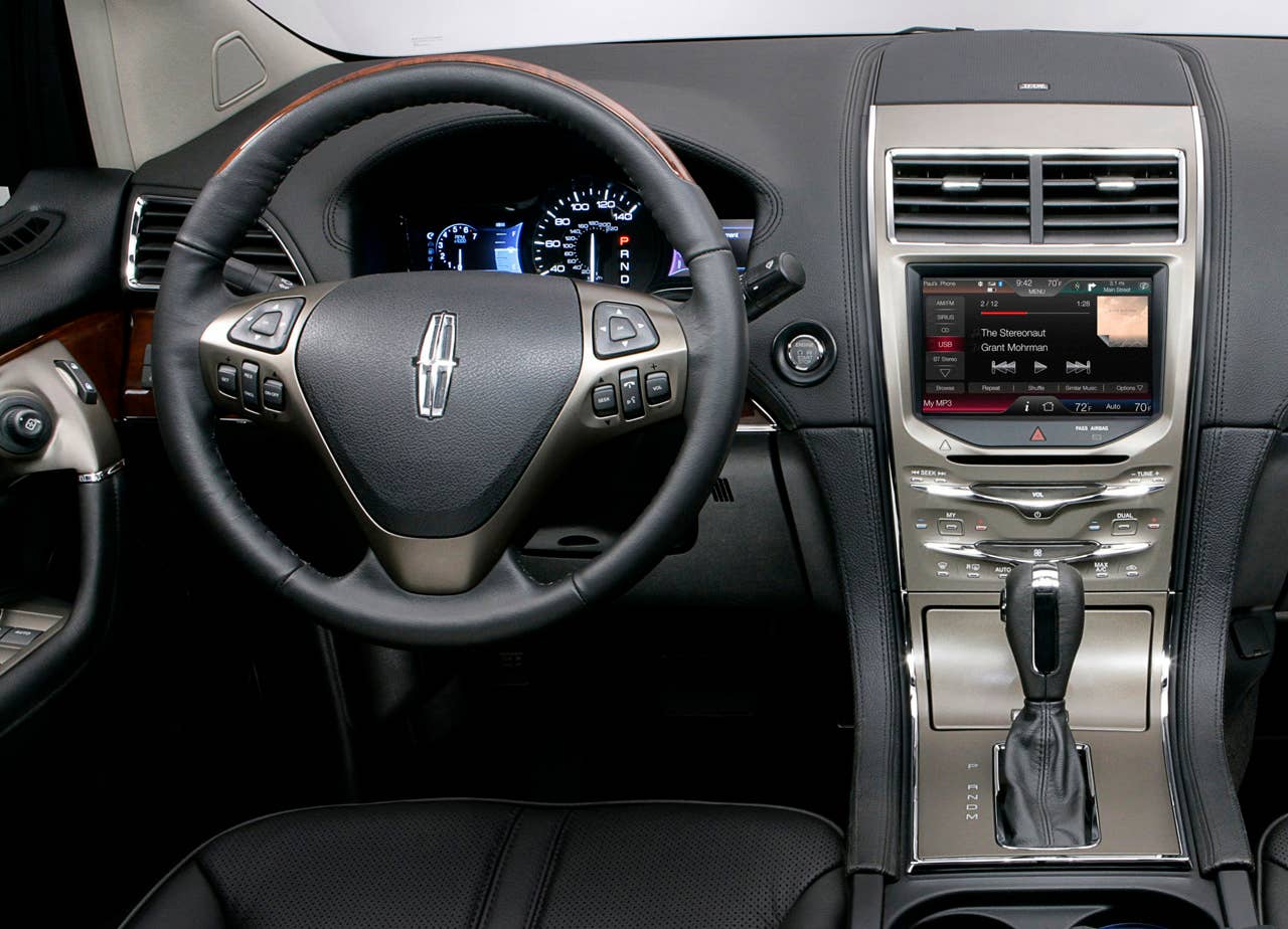 MyLincoln Touch displays information using two 4.2-inch full-color LCD screens flanking an analog speedometer and an 8-inch touch-screen LCD at the top of the center stack.