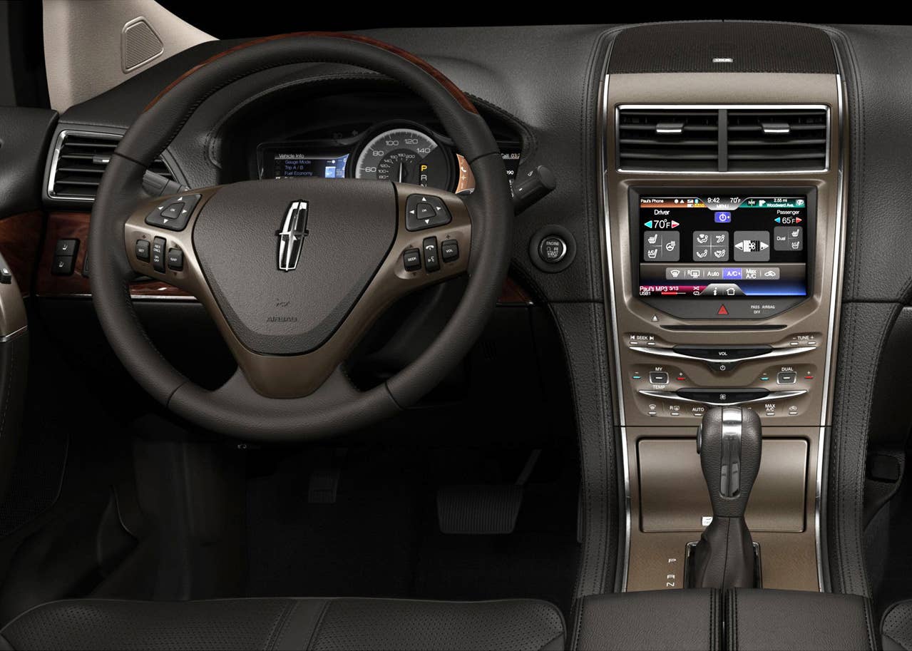 MyLincoln Touch displays information using two 4.2-inch full-color LCD screens flanking an analog speedometer and an 8-inch touch-screen LCD at the top of the center stack.