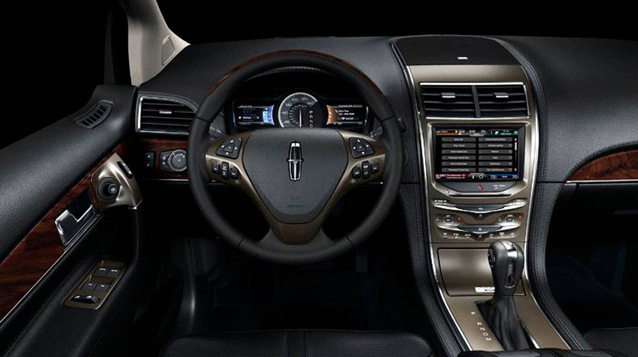 MyLincoln Touch displays information using two 4.2-inch full-color LCD screens flanking an analog speedometer and an 8-inch touch-screen LCD at the top of the center stack. (low resolution image)