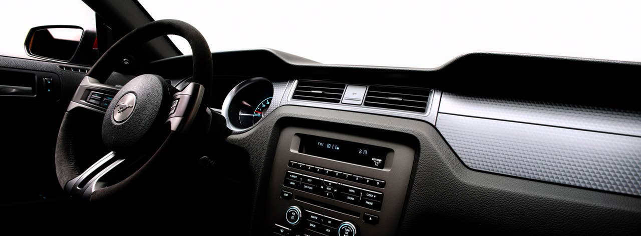2012 Ford Mustang Boss 302 Laguna Seca: An Alcantara-covered steering wheel and special gauge package are two key features setting the Laguna Seca interior apart from standard Mustang models. (08/13/2010)