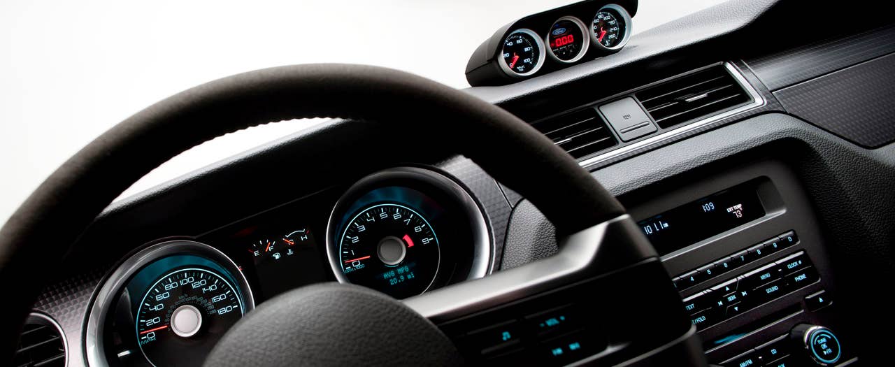 2012 Ford Mustang Boss 302 Laguna Seca: An Alcantara-covered steering wheel and special gauge package are two key features setting the Laguna Seca interior apart from standard Mustang models. (08/13/2010)