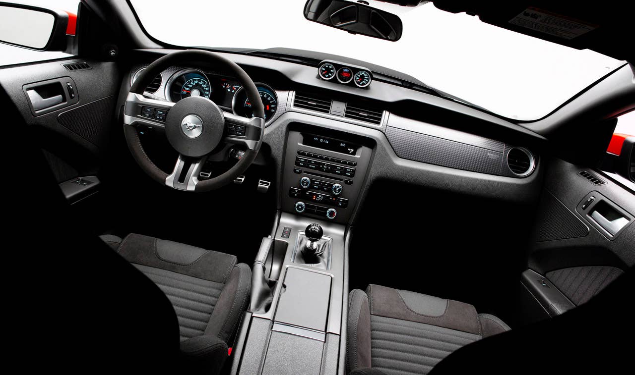 2012 Ford Mustang Boss 302 Laguna Seca: An Alcantara-covered steering wheel and special gauge package are two key features setting the Laguna Seca interior apart from standard Mustang models. (08/13/2010)