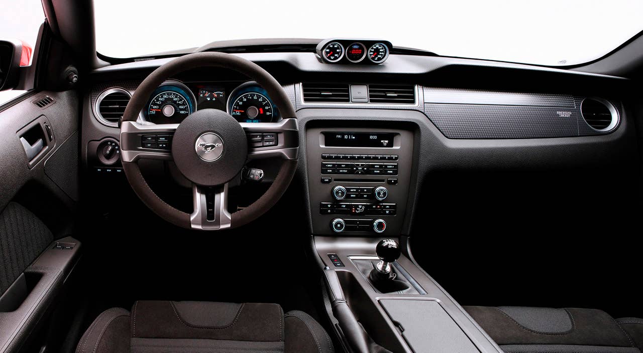2012 Ford Mustang Boss 302 Laguna Seca: An Alcantara-covered steering wheel and special gauge package are two key features setting the Laguna Seca interior apart from standard Mustang models. (08/13/2010)