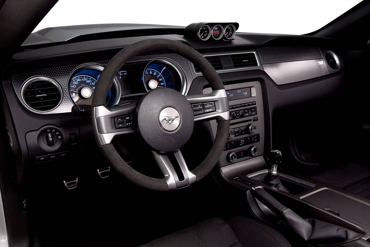 2012 Ford Mustang Boss 302 Laguna Seca: An Alcantara-covered steering wheel and special gauge package are two key features setting the Laguna Seca interior apart from standard Mustang models. (08/13/2010)