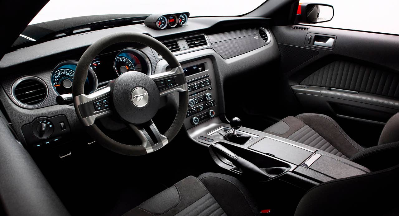 2012 Ford Mustang Boss 302 Laguna Seca: An Alcantara-covered steering wheel and special gauge package are two key features setting the Laguna Seca interior apart from standard Mustang models. (08/13/2010)